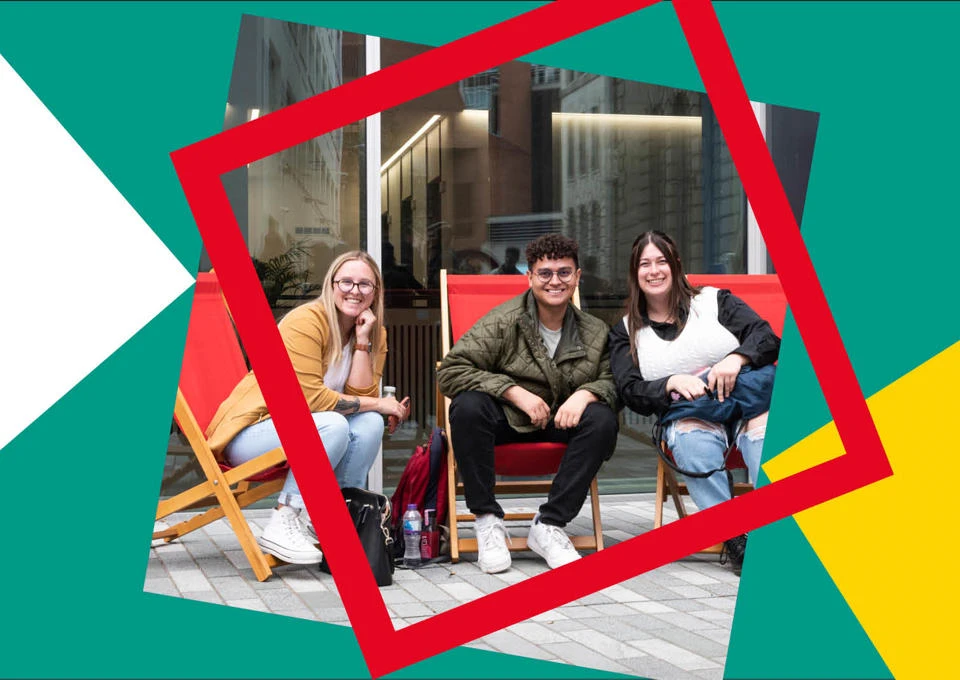 Happy LSE students sitting on LSE deckchairs on campus