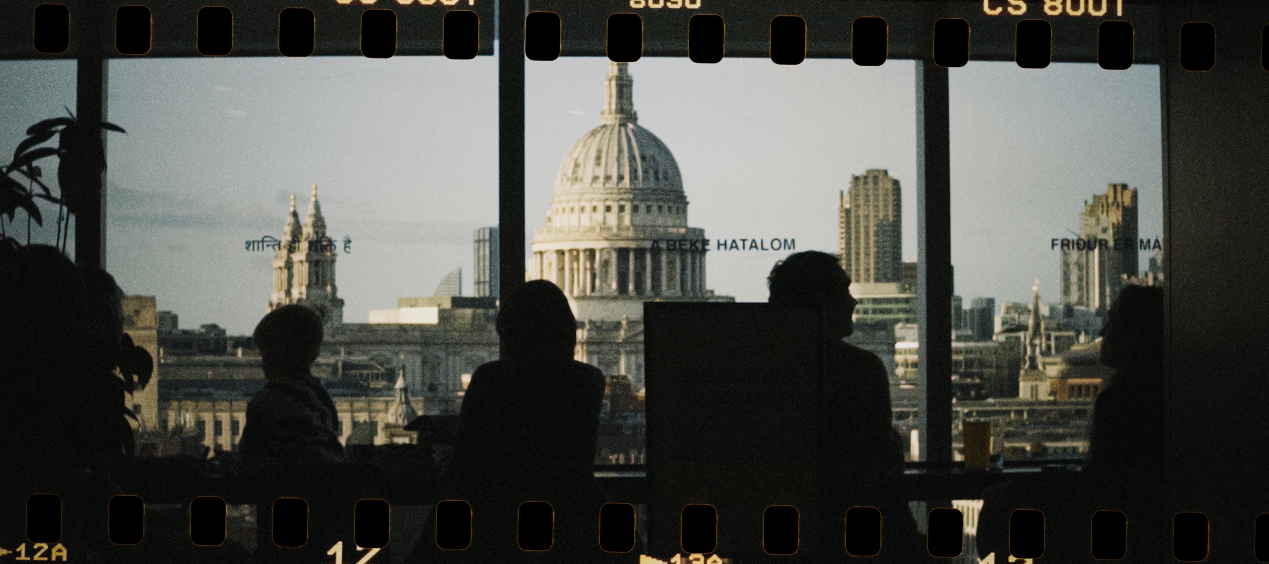 image of St. Paul's Cathedral through the windows of the Tate Modern