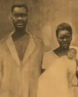 Two enslaved people holding a baby