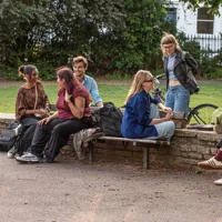 Young people talking in a park