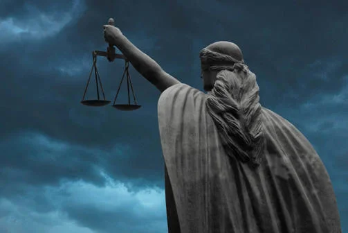 Statue of Lady Justice blindfolded holding scales.