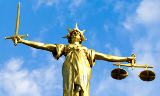 The statue of justice, which stands on the Old Bailey courthouse in London.