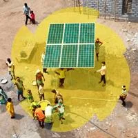 Construction workers holding solar panel