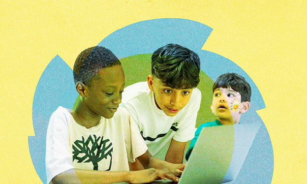 Three boys working on a laptop