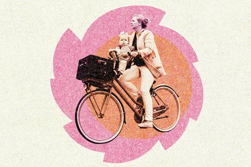 A woman with her child on a bicycle