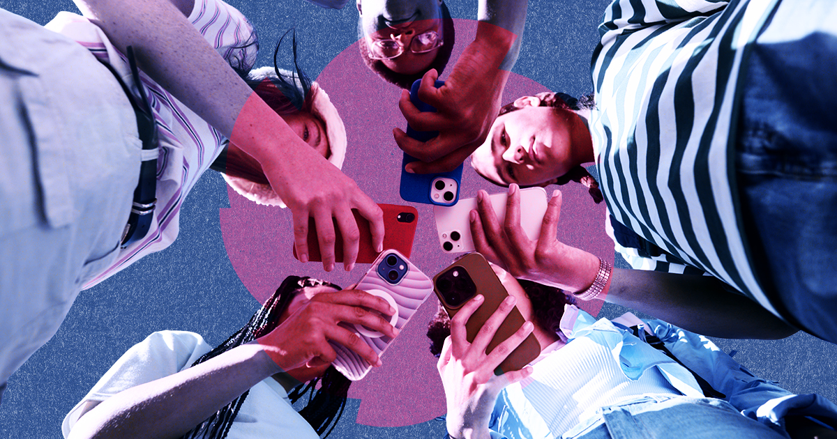 A group all looking down at their mobile phones