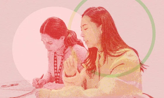 Two women working together
