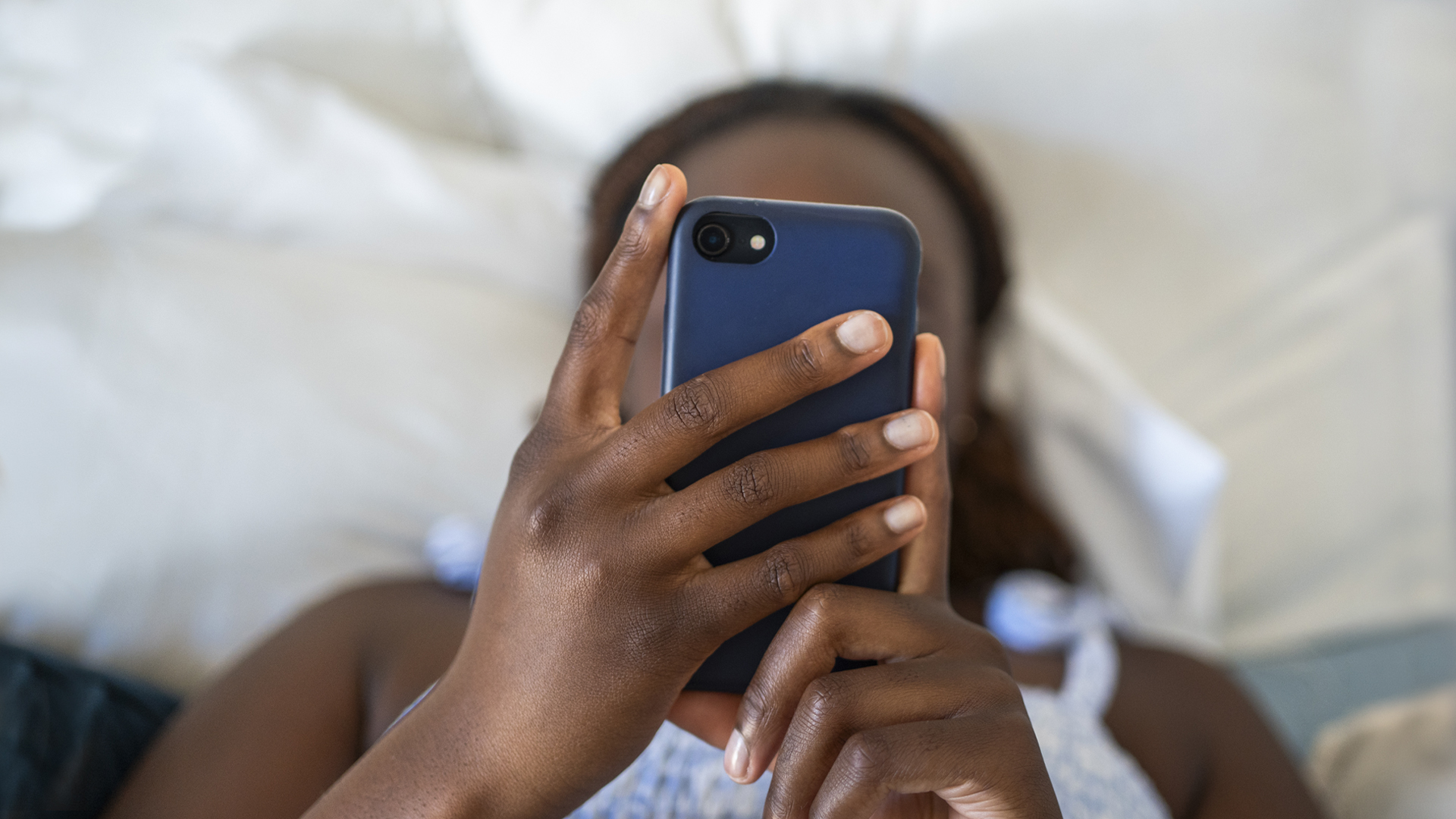 a woman holding a mobile phone