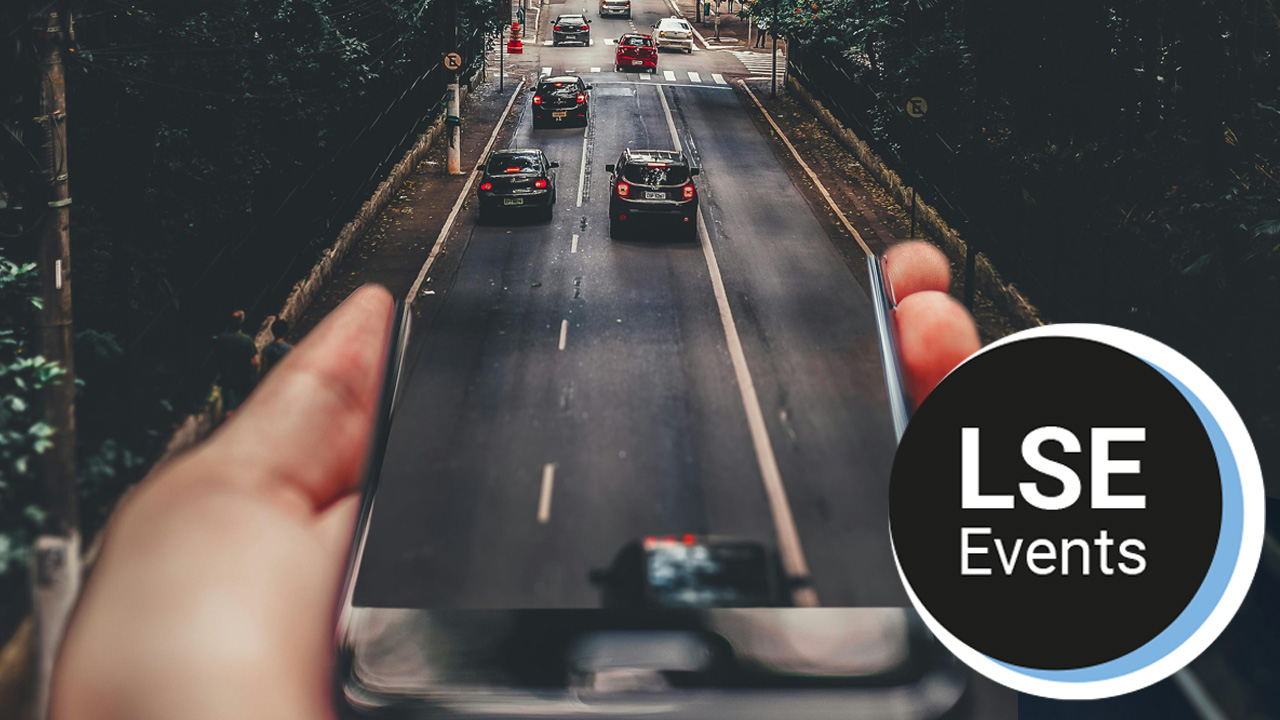 cars-running-on-road-below-smartphone