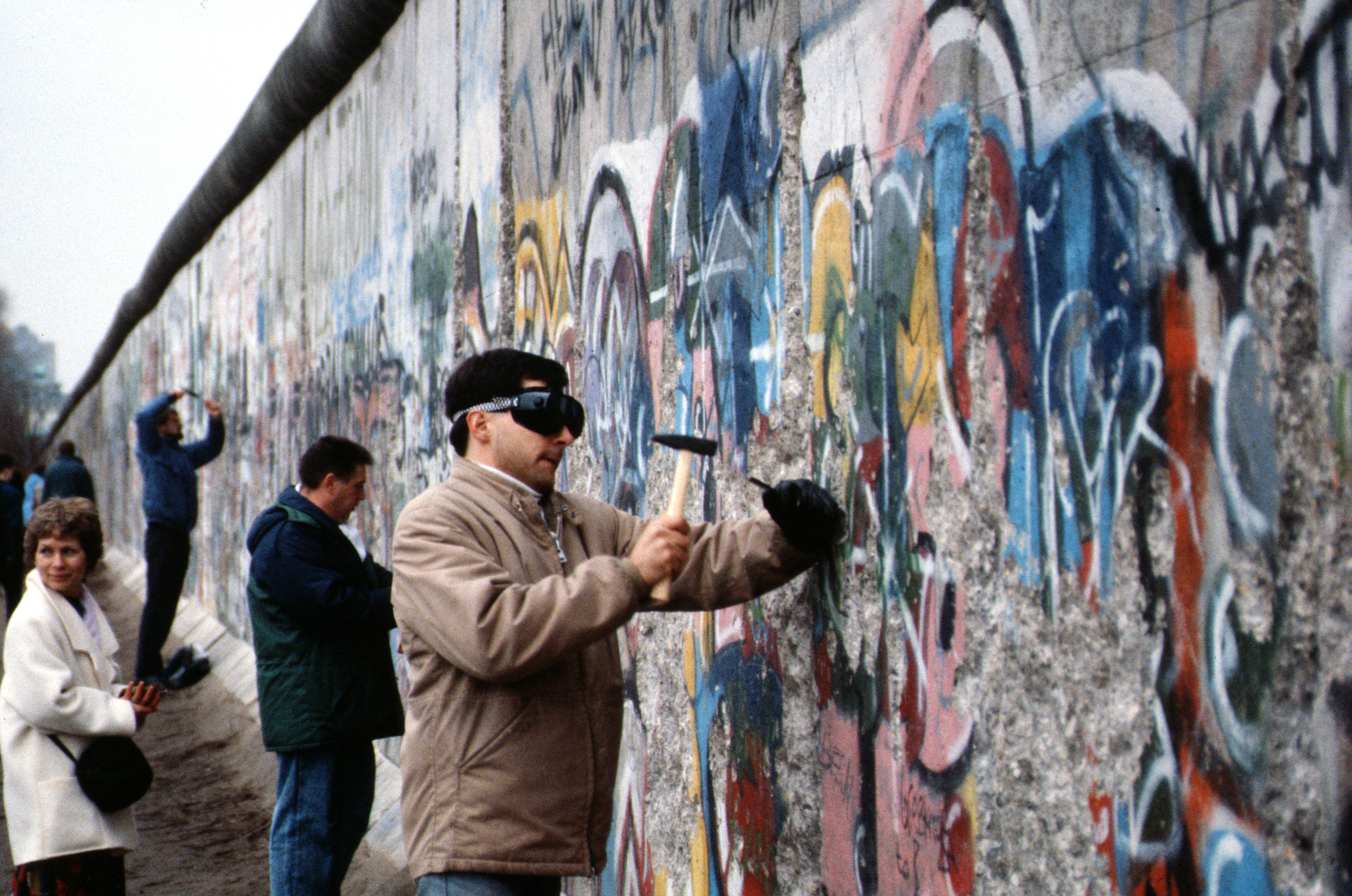 People breaking down the Berlin wall