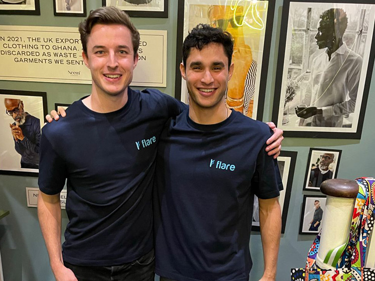 Flare co-founder Alex Hooper stands with Daniel during a Flare event with the Neem fashion brand