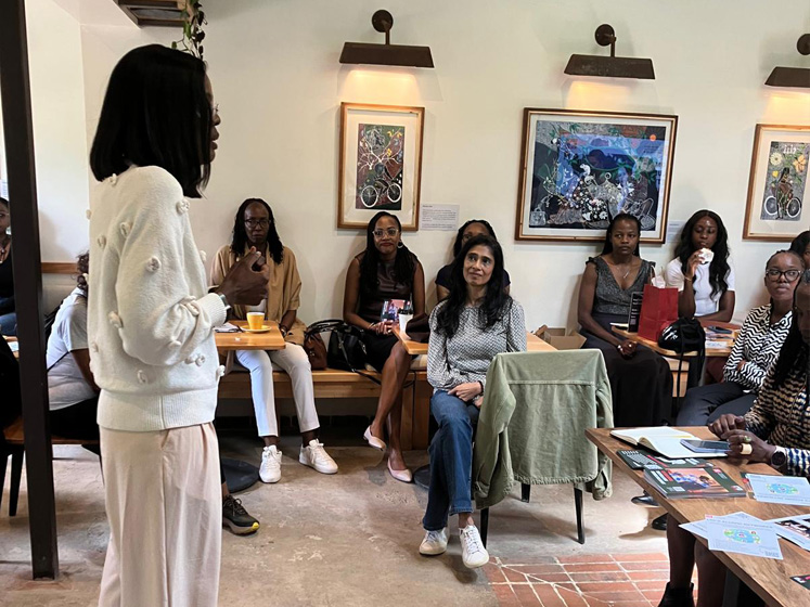 Yvonne Ndege speaks to alumnae at Spring Valley Coffee