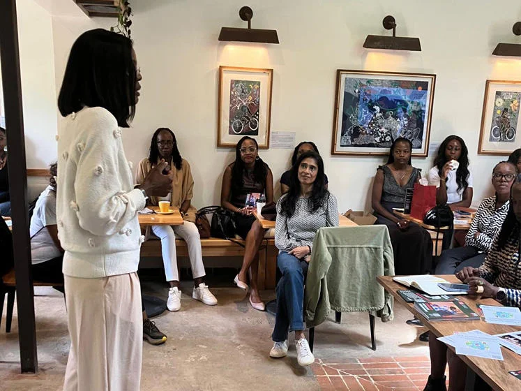 Yvonne Ndege speaks to alumnae at Spring Valley Coffee