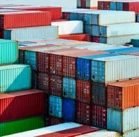 Shipping containers piled up in a dock