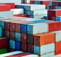 Shipping containers piled up in dock yard
