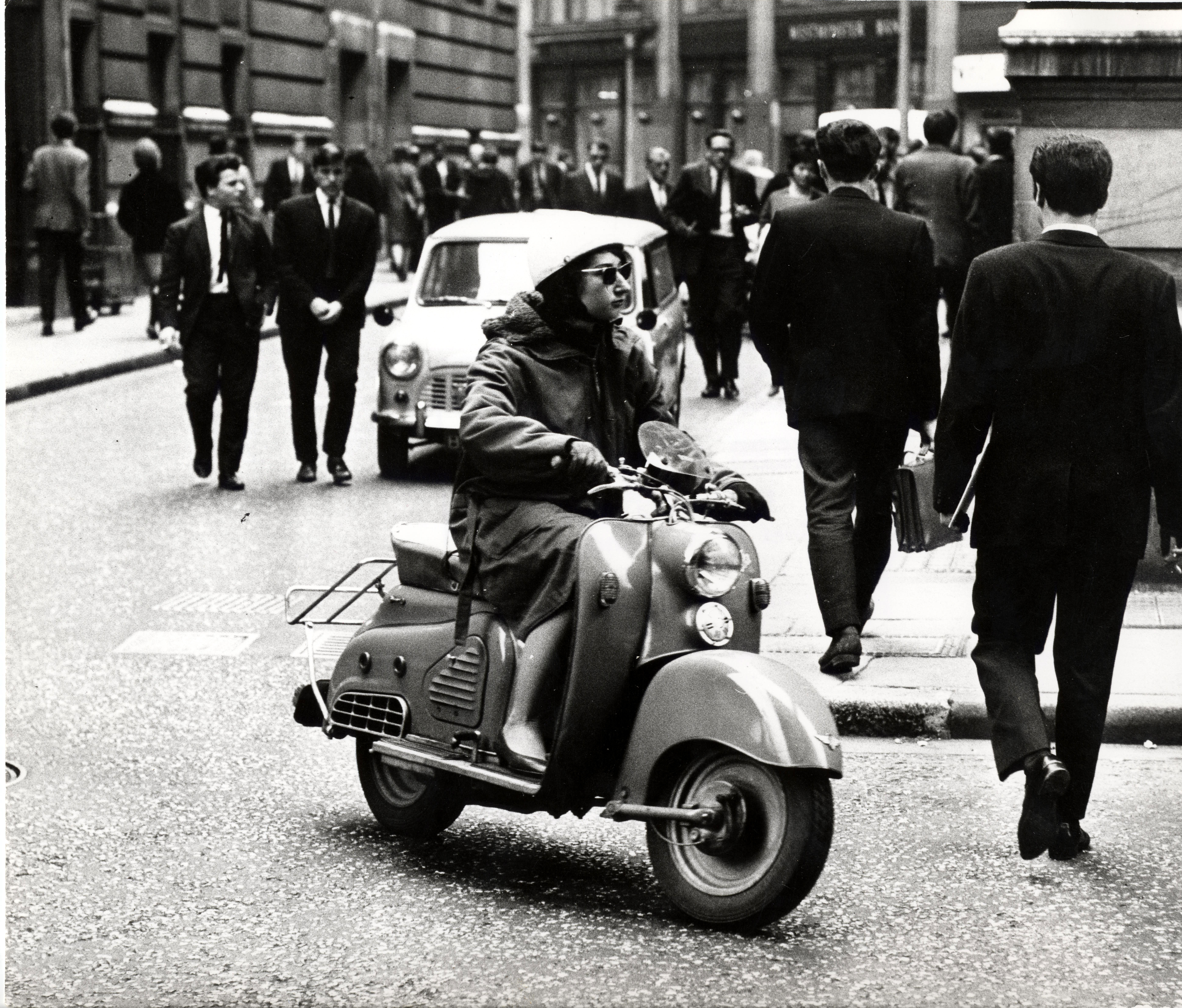 Woman on a scooter, Houghton Street c.1950s-1960s