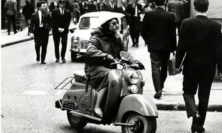 Woman on a scooter, Houghton Street c.1950s-1960s