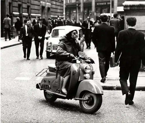 Woman on a scooter, Houghton Street c.1950s-1960s