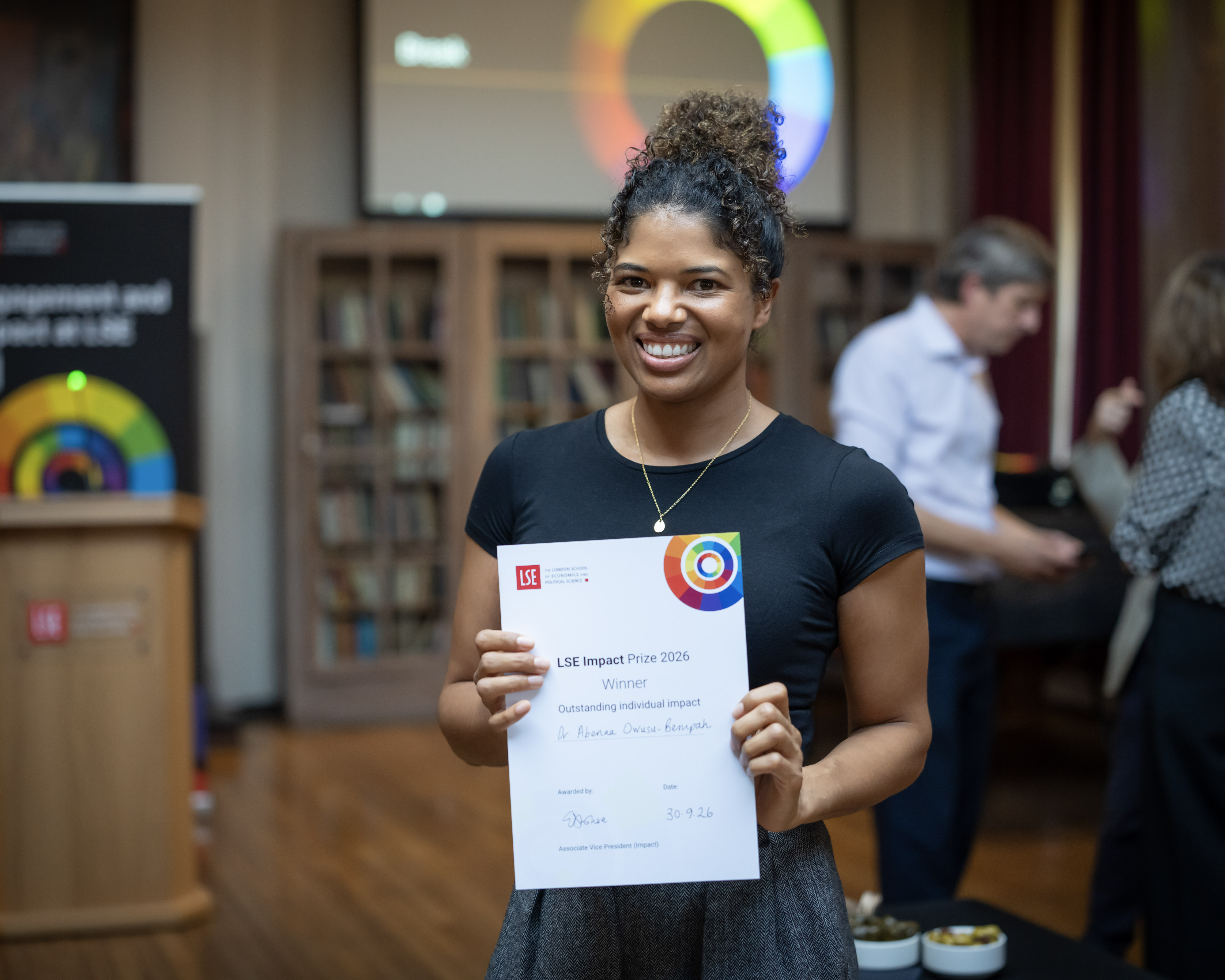 Dr Abenaa Owusu Bempah holding a certificate