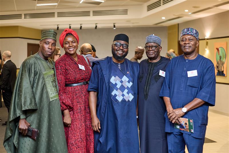 A group of alumni pose for a group photo in Abuja - image by Alpha Morgan