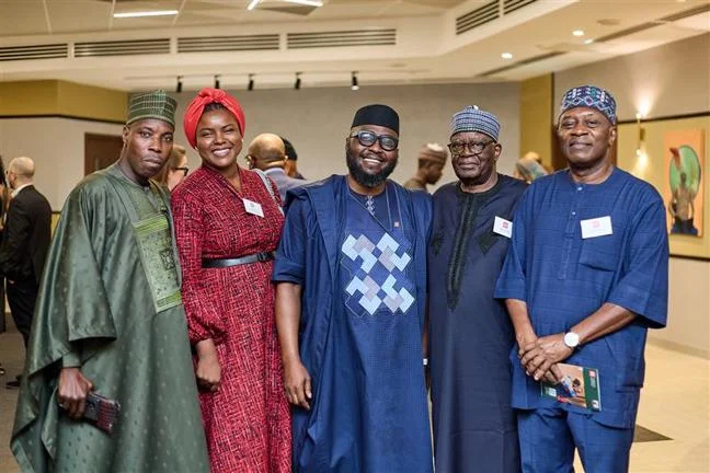 A group of alumni pose for a group photo in Abuja - image by Alpha Morgan