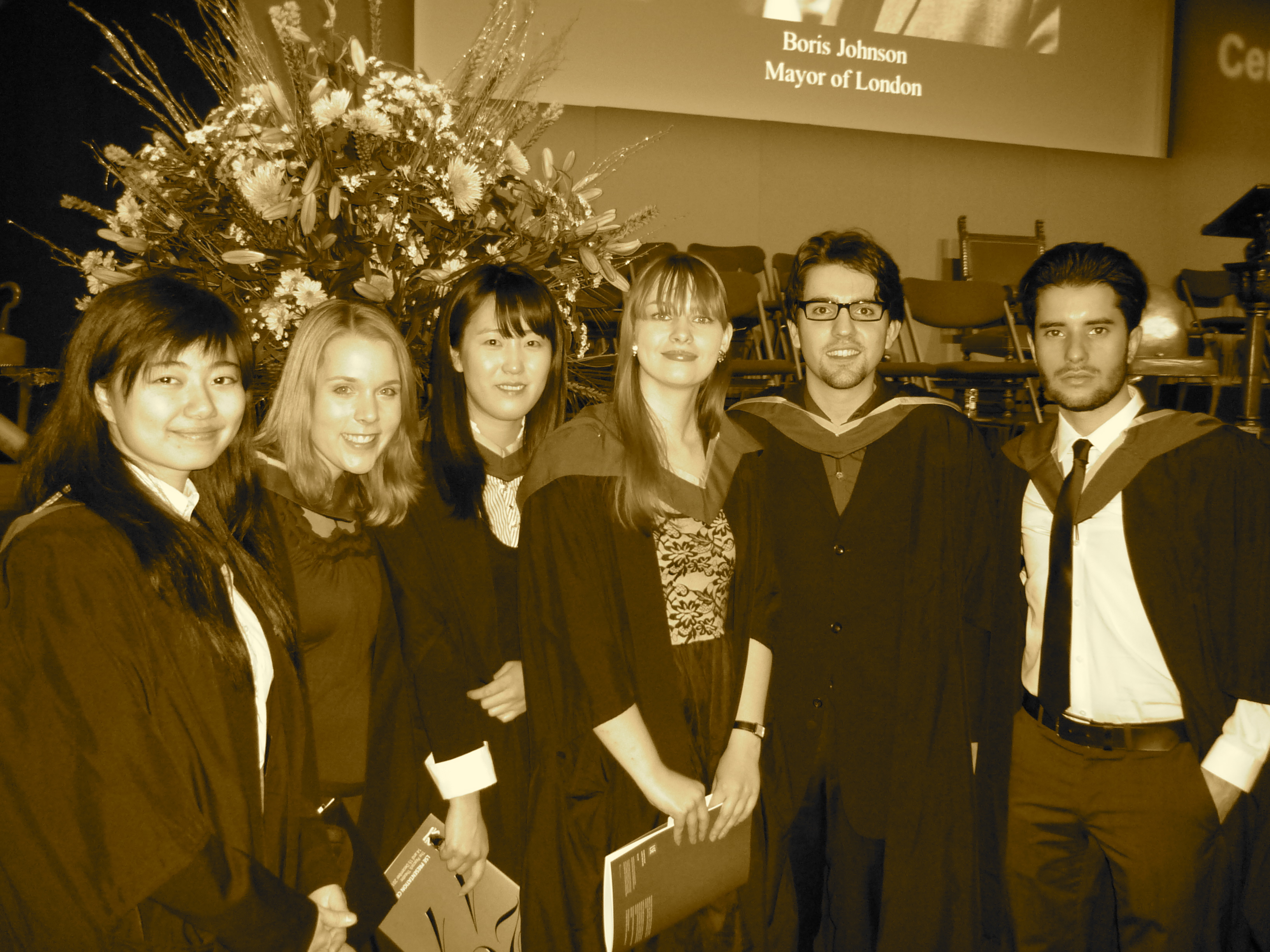 photo with sepia filter of six students at graduation in 2011