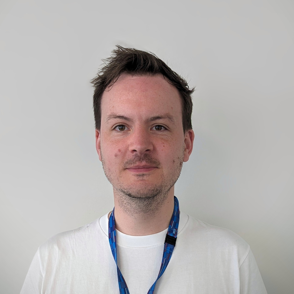 Man smiles looking at the camera