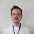 Man smiles looking at the camera