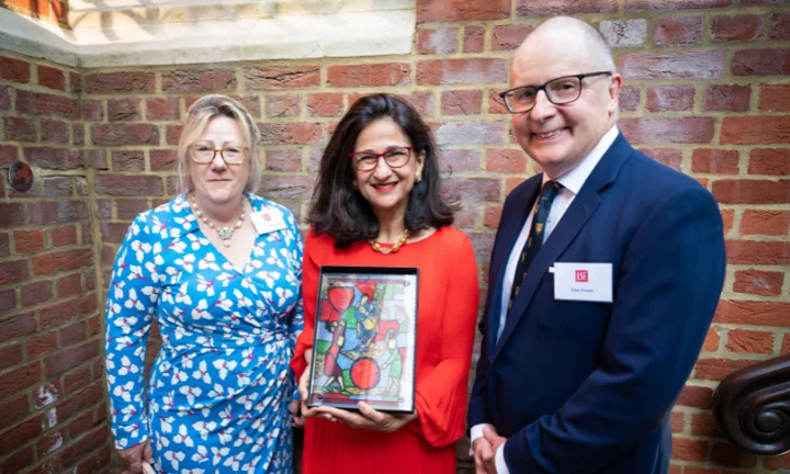 Alison and Tim Rankin Frost flanking Minouche Shafik who is holding Fabian Window