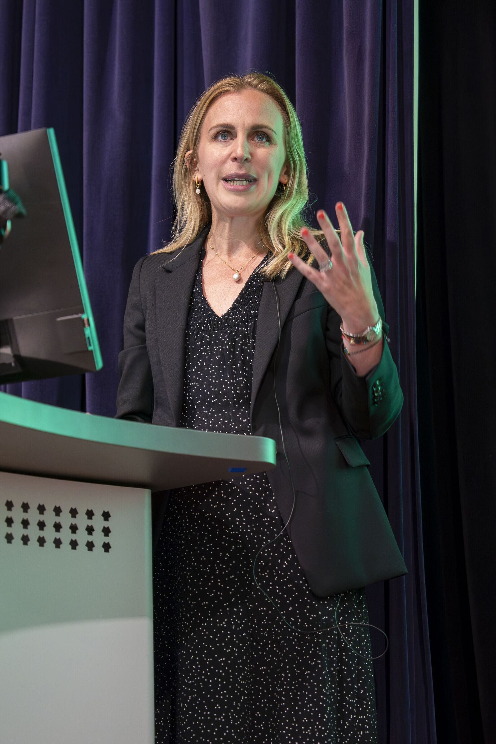 Anan Valero speaking at an event 