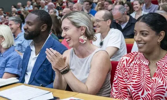 Events audience clapping and smiling