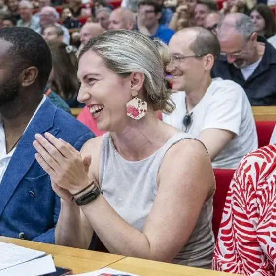 Events audience clapping and smiling