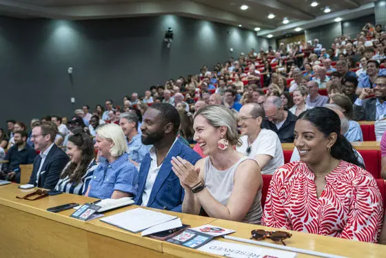 Events audience clapping and smiling