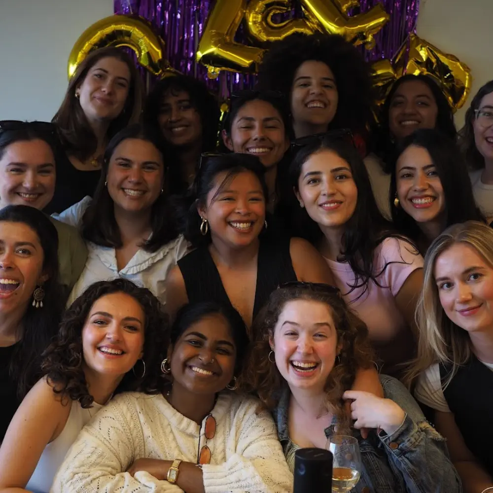 A group of students smiling at a celebration