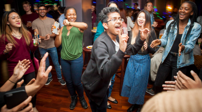 Students dancing in a bar