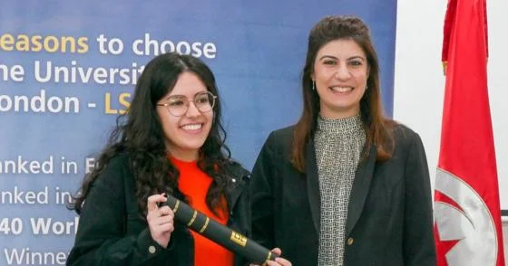 Baya (left) holding her 202526 letter of commendation