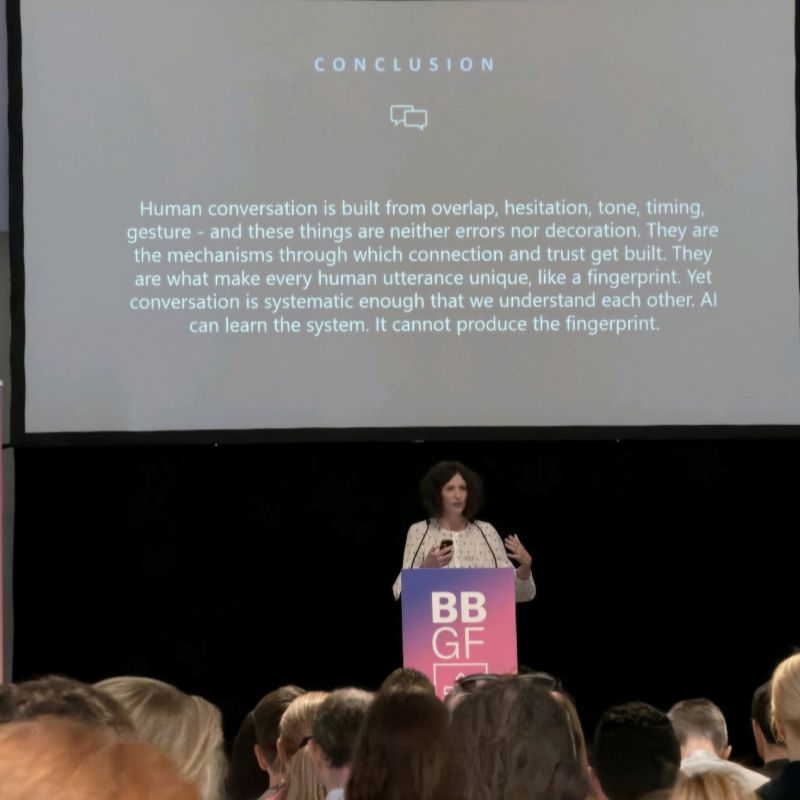 Elizabeth Stokoe giving a talk at the Beyond Boundaries Global Festival in 2026. 
