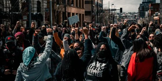 A large group of Black Lives Matters protesters with signs