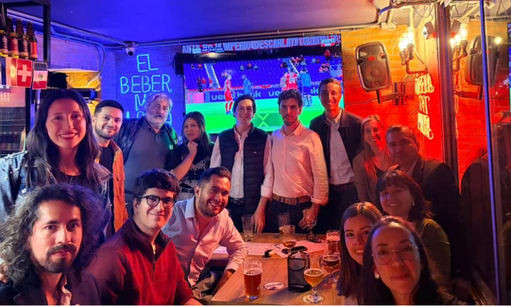 A group of alumni smiling at an event in Bogota.