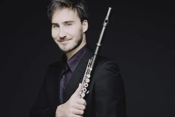 Boris Bizjak holding a flute.