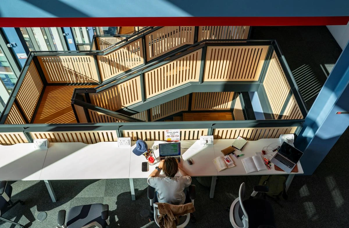 Student studying in the Centre Building at the LSE campus