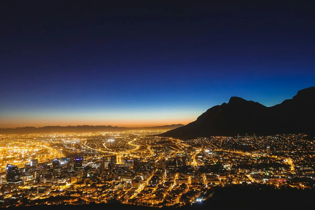 Nightscape of Cape Town from the air. Lights and sunset are viewable.