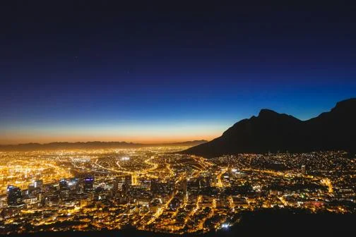 Nightscape of Cape Town from the air. Lights and sunset are viewable.