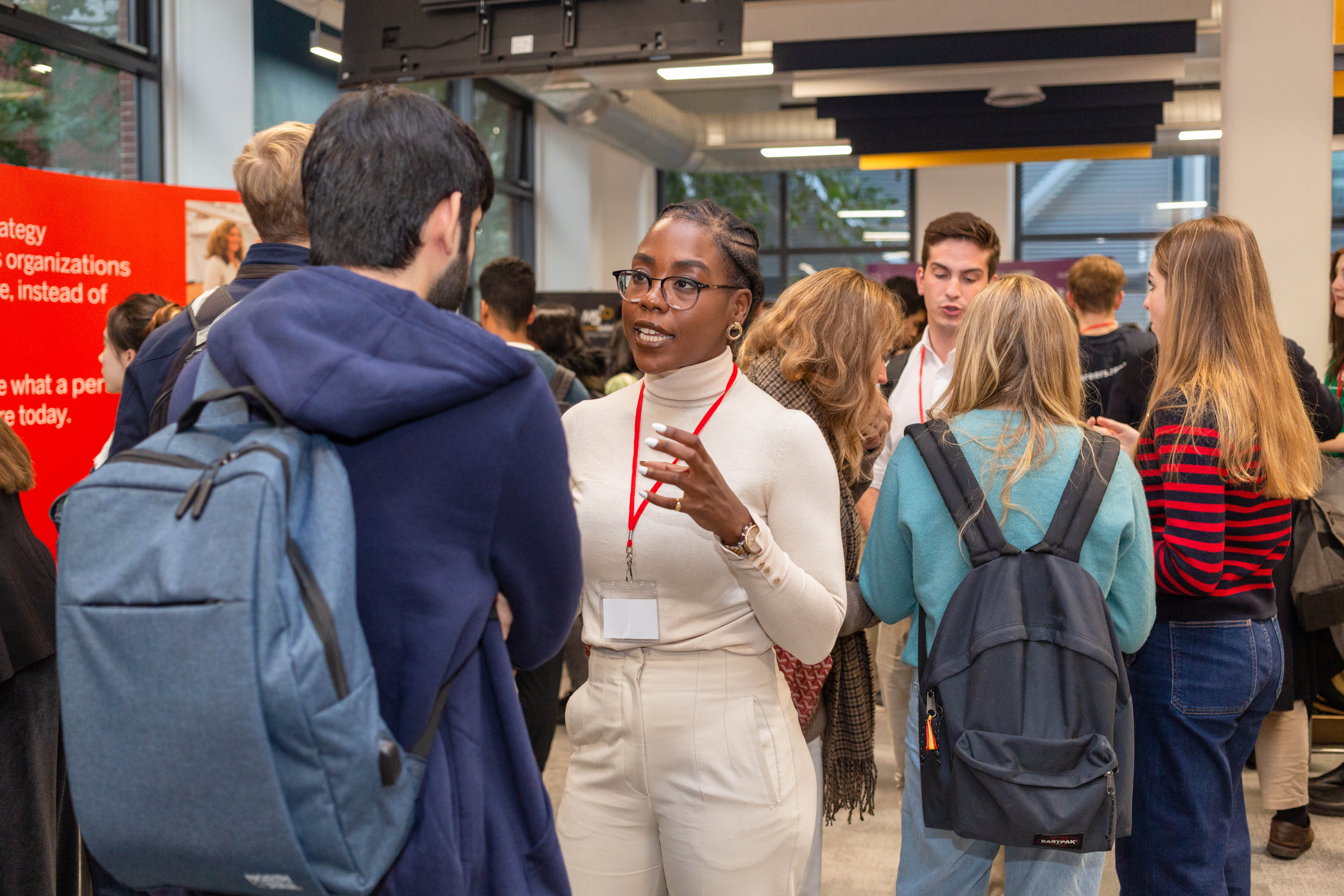 An LSE staff member talks to a student