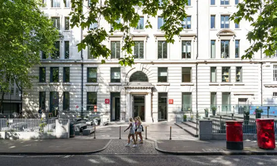 The Cheng Kin Ku Building in summer with students walking past