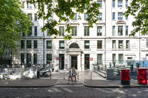 The Cheng Kin Ku Building in summer with students walking past