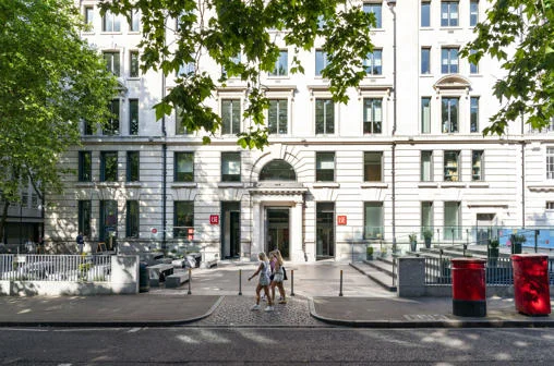 The Cheng Kin Ku Building in summer with students walking past