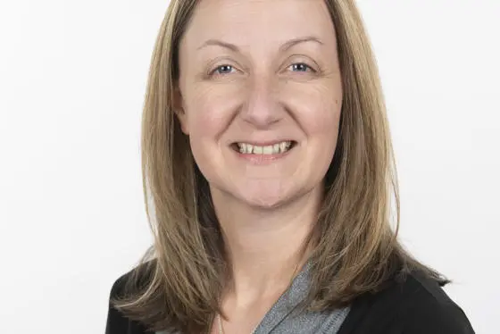 Claire Miller in front of a white background.