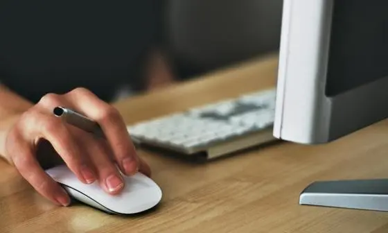 Hand clicking a mouse