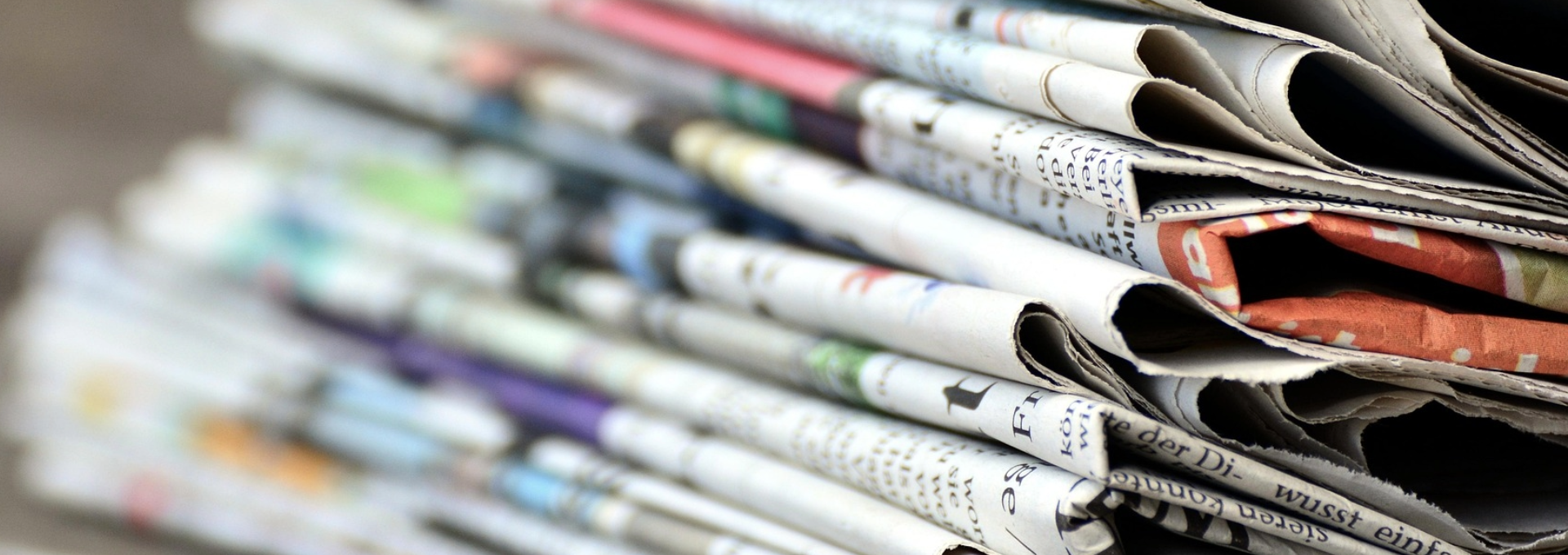Close-up photo of pile of newspapers